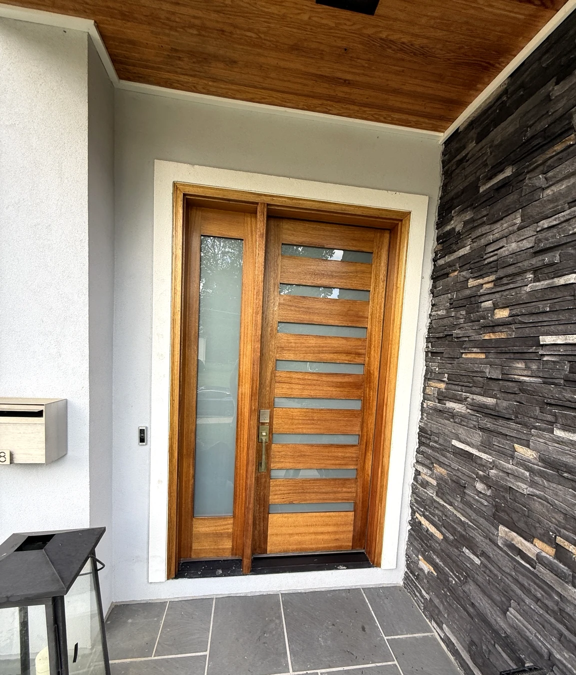 Restored wood entry door after refinishing