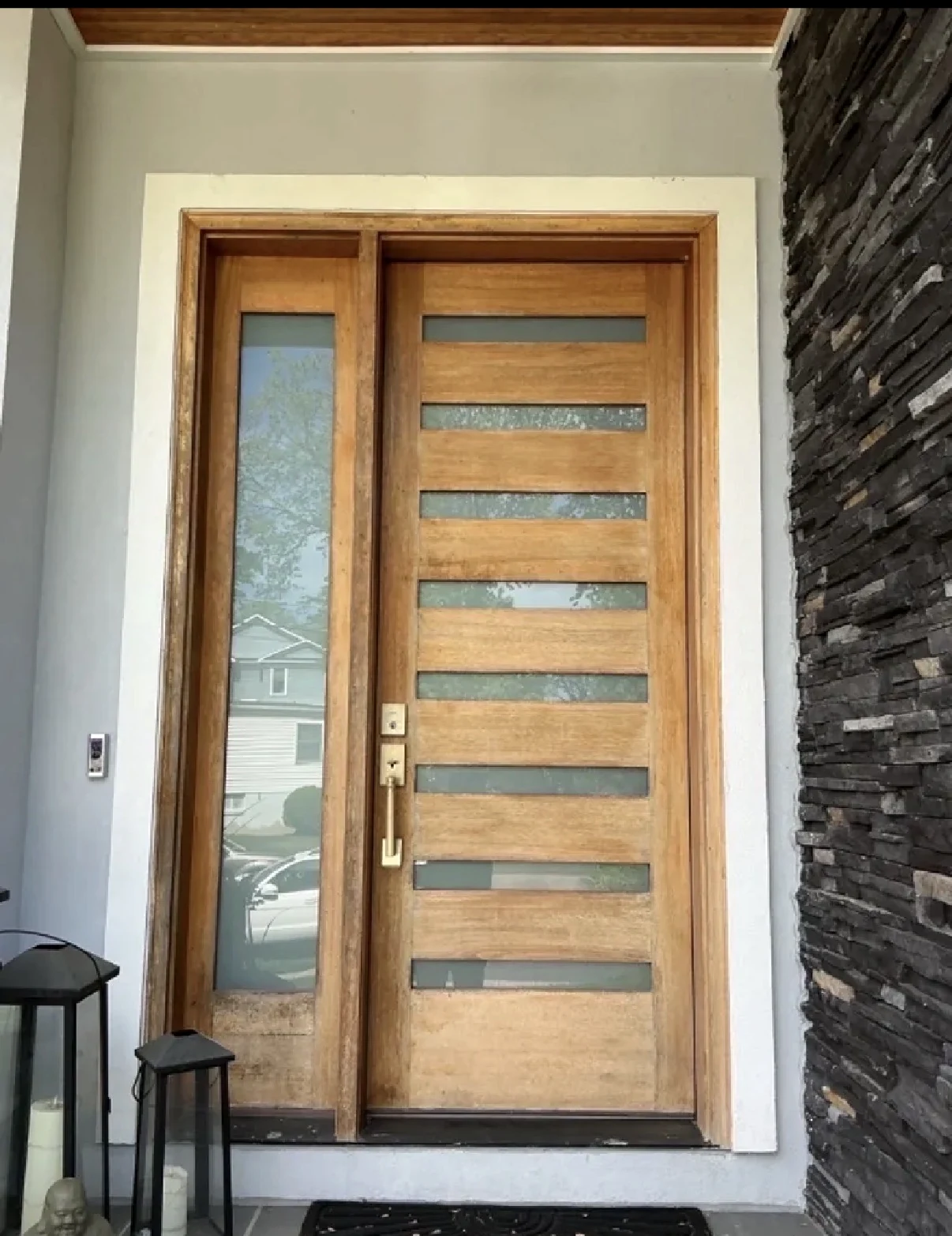 Weathered wood entry door before refinishing