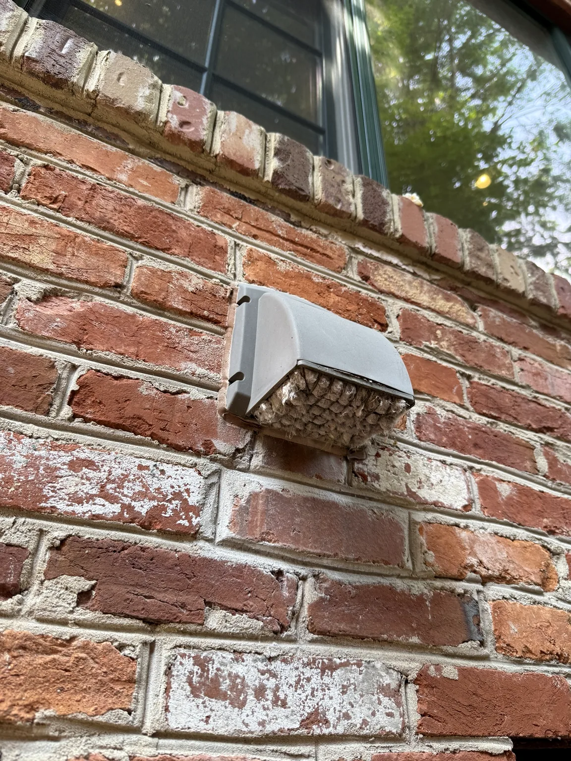 Exterior wall vent on brick