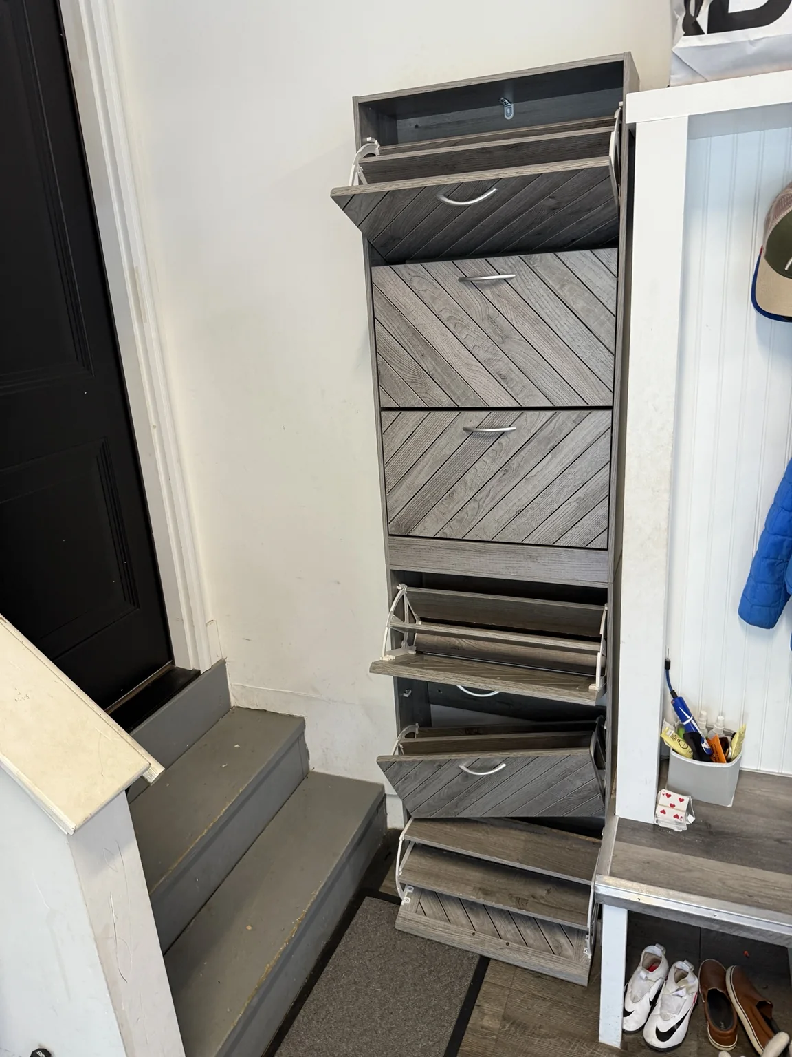 Dark tilt-out shoe cabinet before conversion