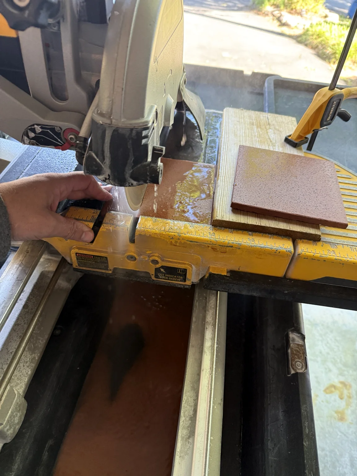 Italian tile being precision cut with a wet saw