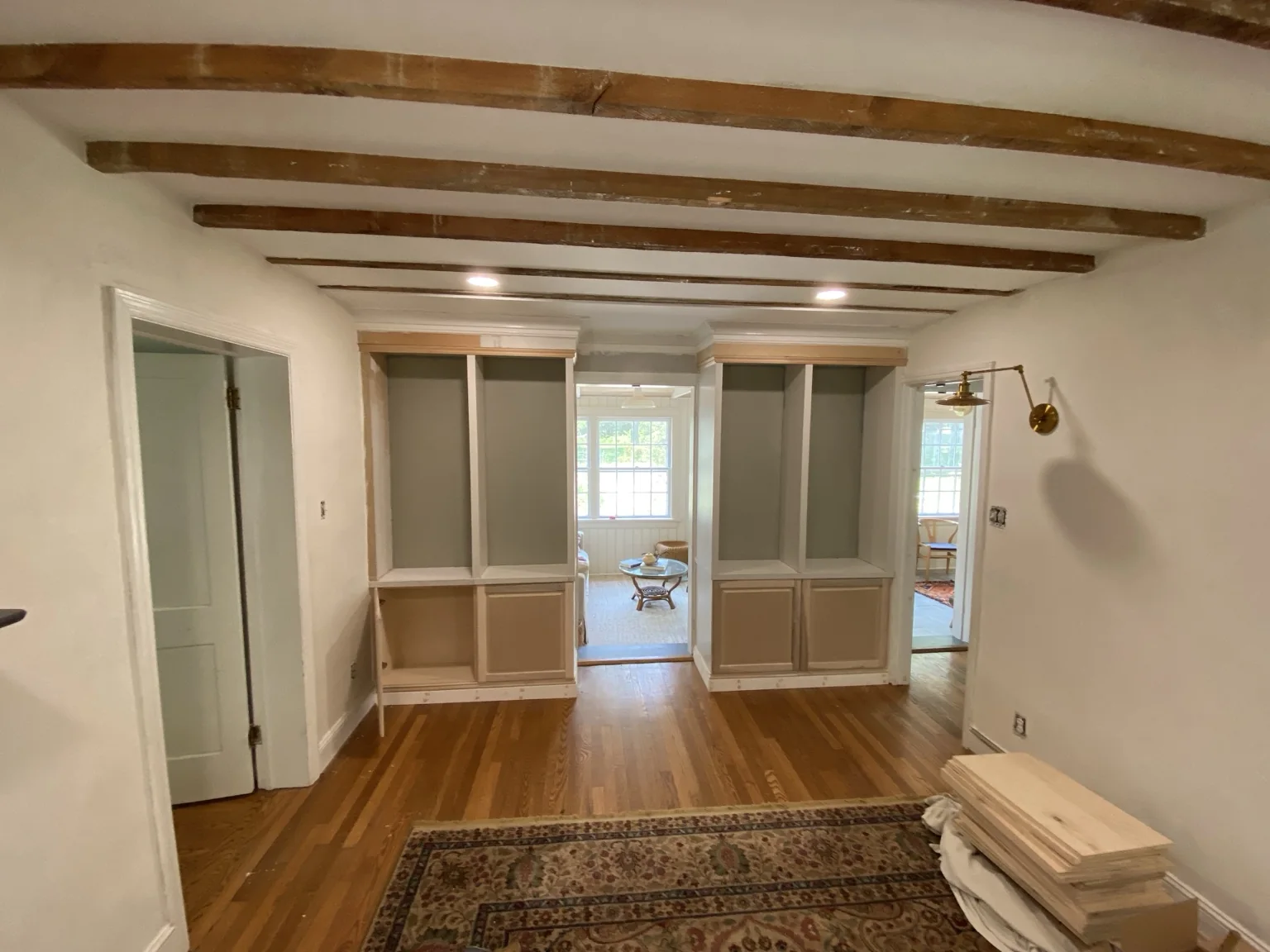 Finished room with custom built-ins, wide view after restoration